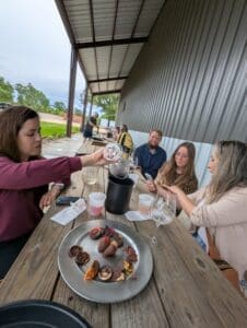 Drink wine and eating chocolate covered fruit